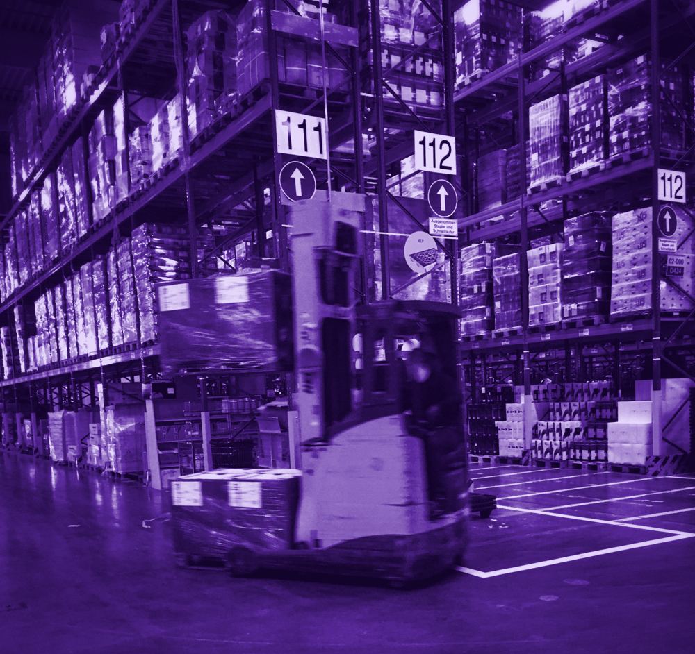 Forklift in a warehouse aisle